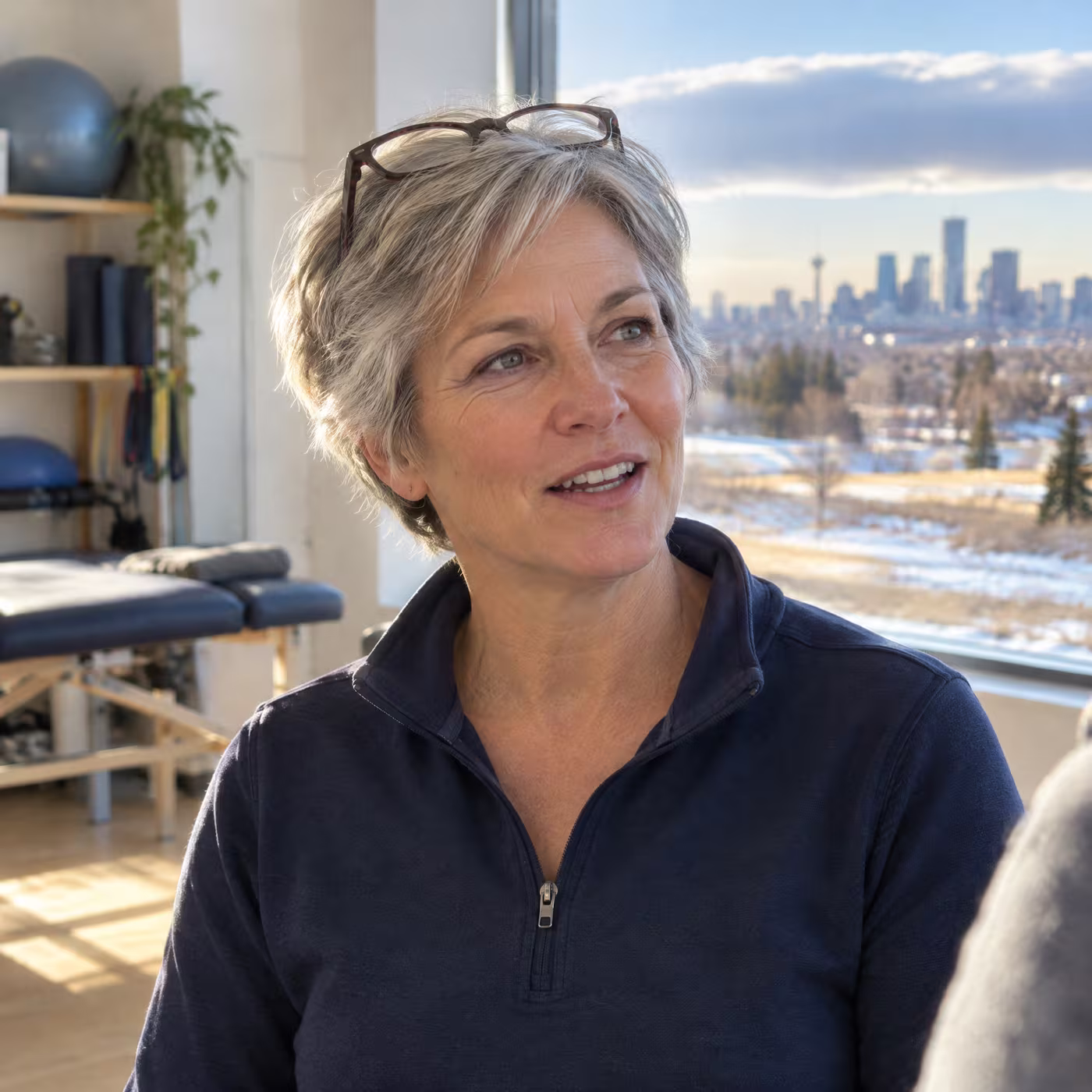 Physiotherapist Dana Szabo talking with a patient in the clinic